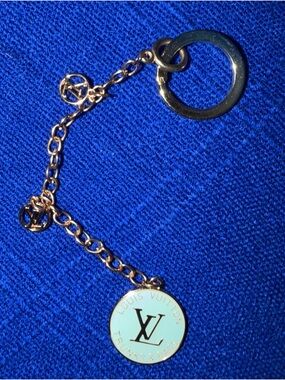 Blue emblem with “Louis Vuitton” Gold-Tone Blue Enamel Charm Keychain. Not Ath